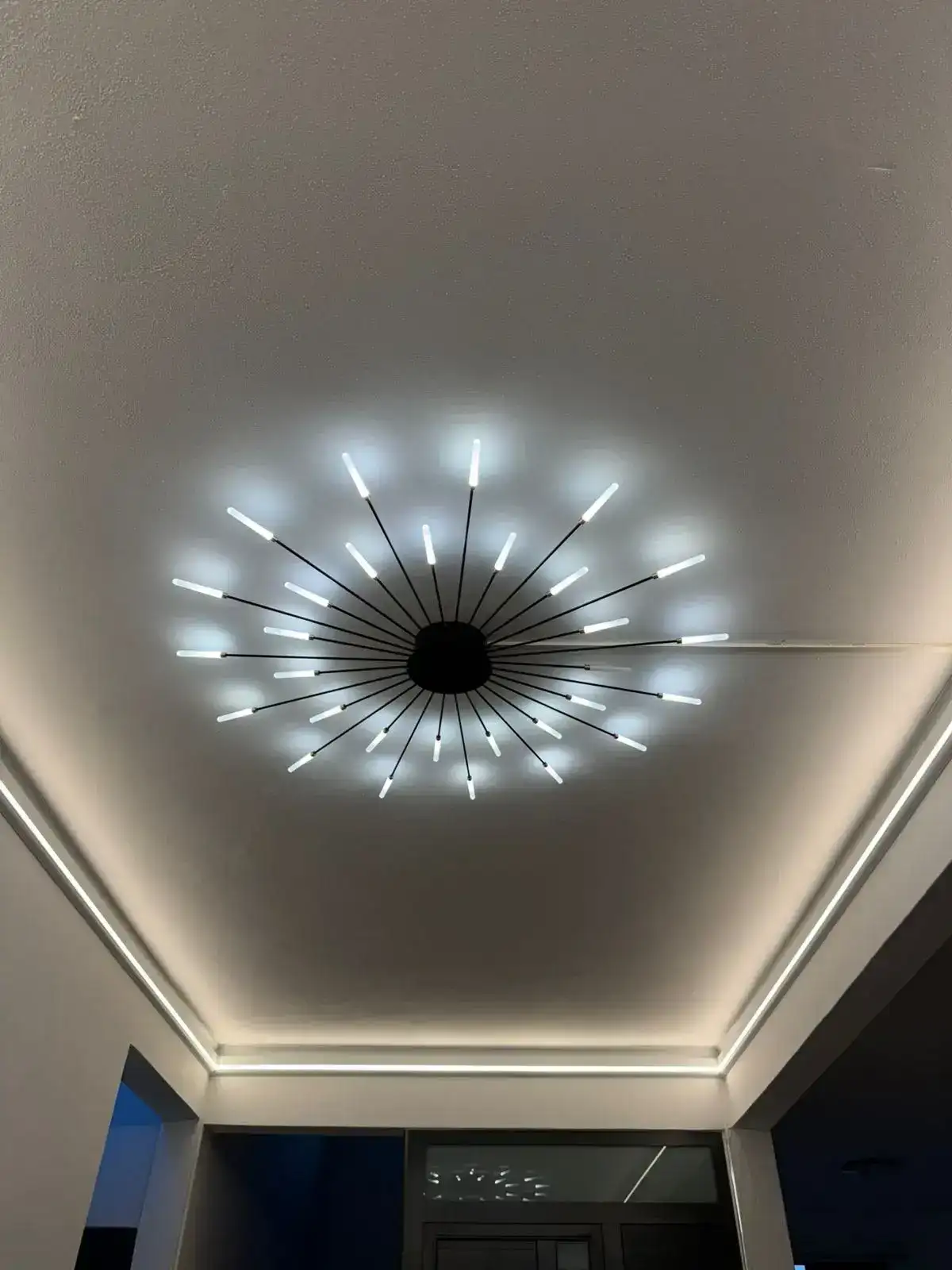 Second view of chandelier and cove lighting