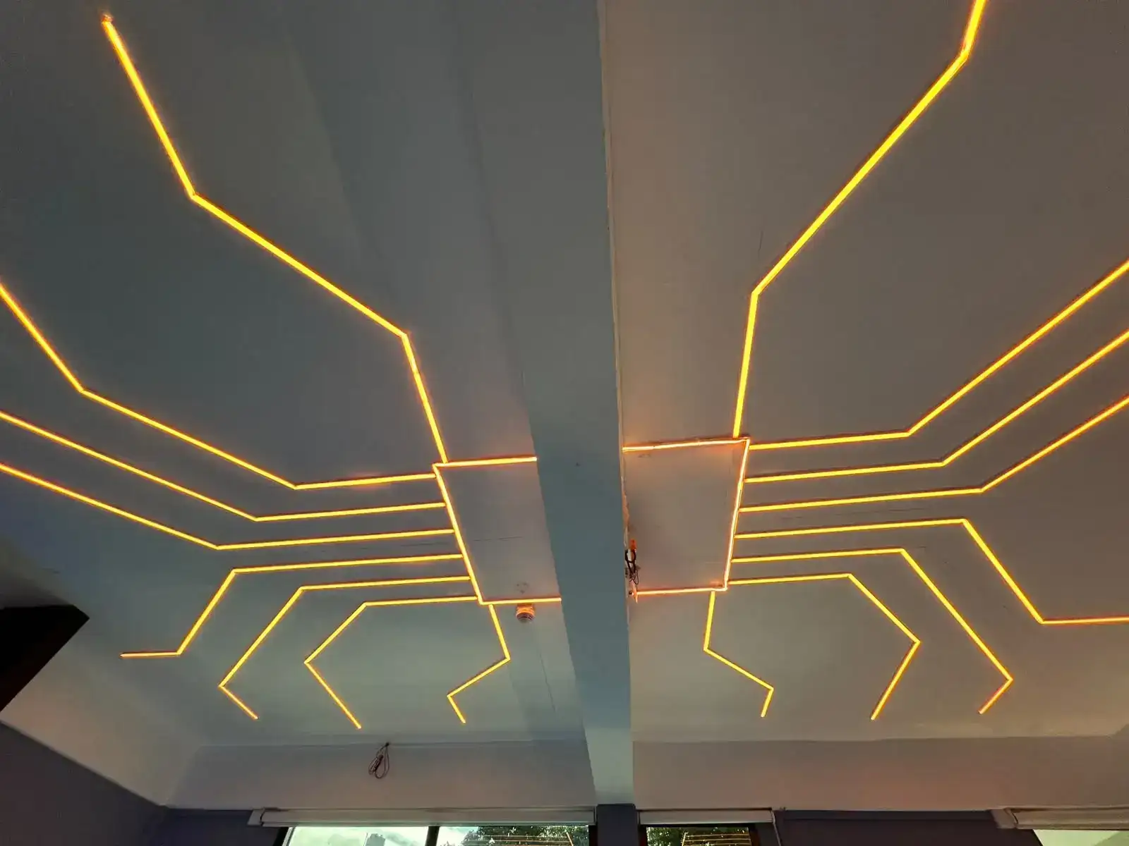 Geometric warm linear ceiling lighting